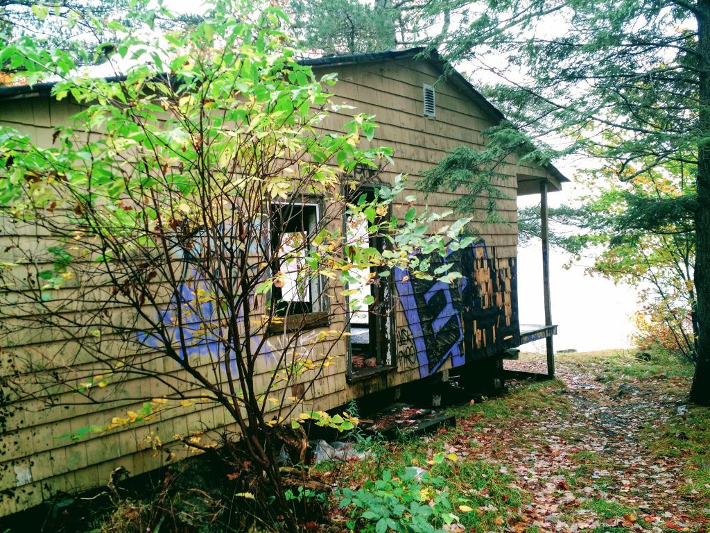 An abandoned cabin has been hit with lots of graffiti. No connection to rocket stoves - although it would be nice to have one if you had to spend time there.